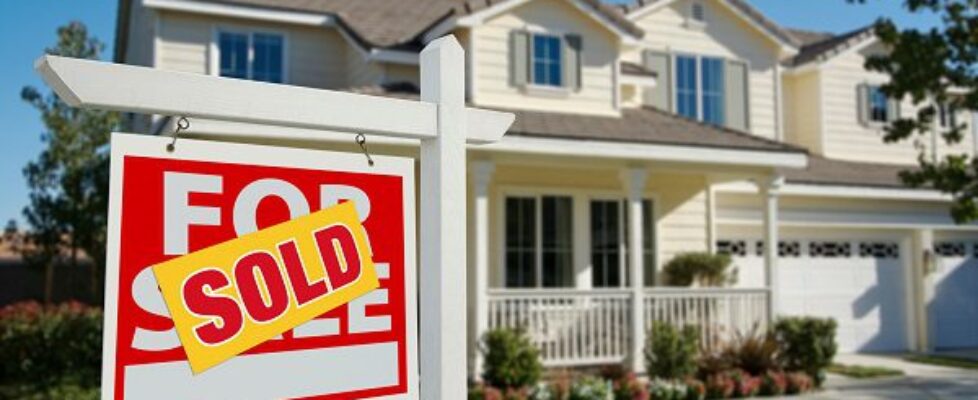 Sold Home For Sale Sign in Front of New House